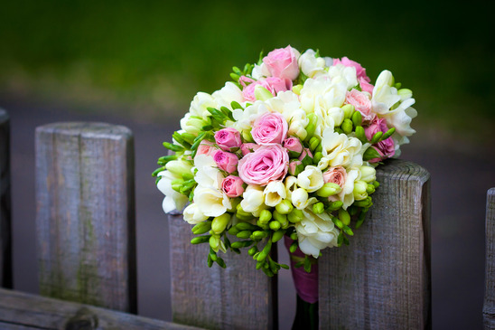 wedding bouquet on rustic fence