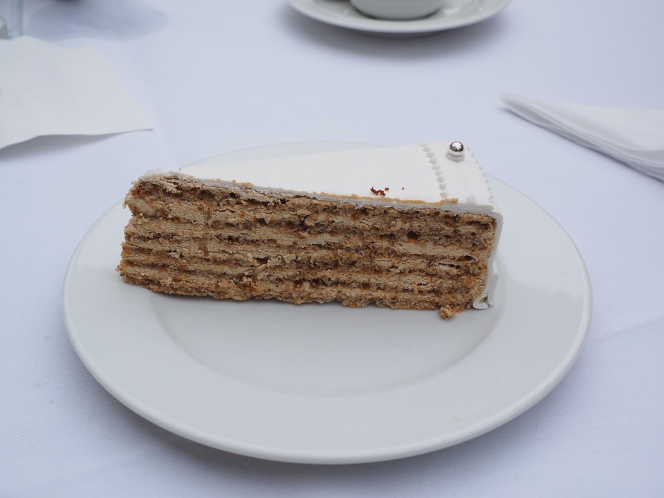 Slice of vanilla wedding cake with fondant