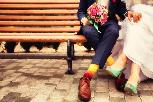 modern bride and groom on bench
