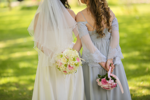 Bride with flowers and maids of honor